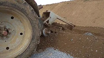 Работа БАРы, траншеекопатель